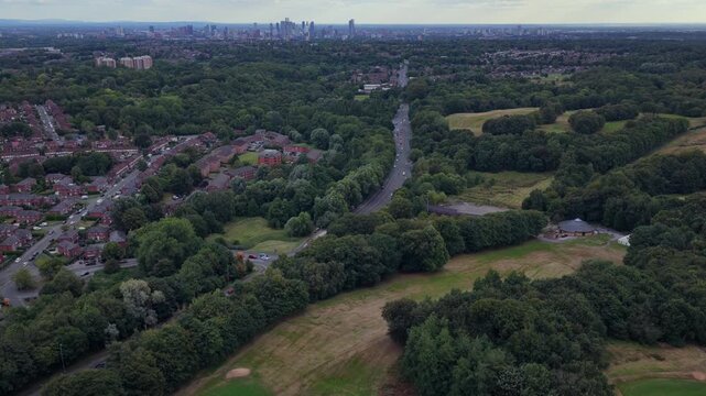 Aerial video of Manchester Skyline Viewed Across Heaton Park Greens