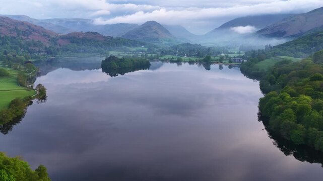 Aerial view over Grasmere Lake, early morning mist and reflections, Cumbria.