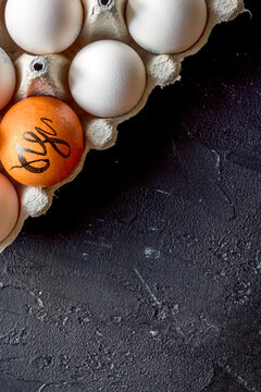 concept of correct choice eggs on dark background top view
