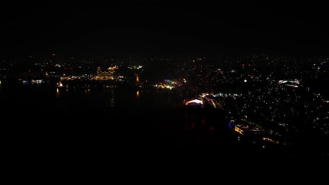Night Aerial view of Tank bund with Secretariat, Dr. B. R. Ambedkar's Statue and color full fireworks on sky at Necklace Road, hyderabad, telangana, india. night time, push in shot, drone shot, 4k.