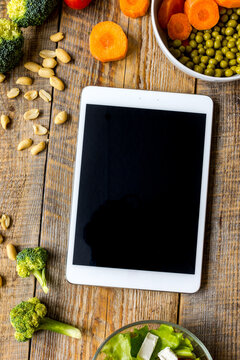 concept diet and tablet with vegetables mock up