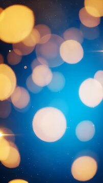 Soft Blue Background With Warm Glowing Lights - A soft blue background is illuminated by numerous warm, glowing bokeh lights of various sizes.