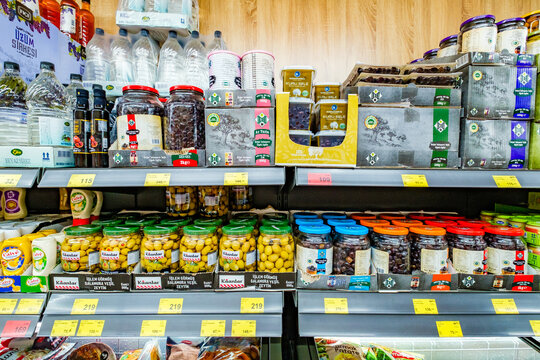 Beldibi, Turkey &ndash; april 30, 2025: olives in jars on supermarket shelves