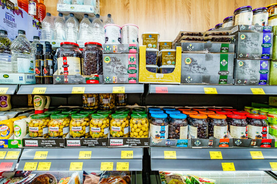 Beldibi, Turkey &ndash; april 30, 2025: olives in jars on supermarket shelves