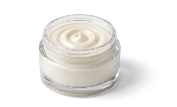 Open glass jar of white cream on white background with soft top swirl and glossy reflections