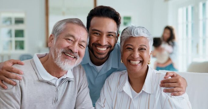 Senior, face and parents with adult son in home for family time, holiday bonding or growth together. Portrait, elderly mom and dad with man, hug or smile for parenthood, development or love in house