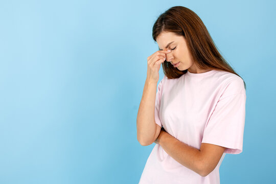 Woman feeling headache or sinus pain