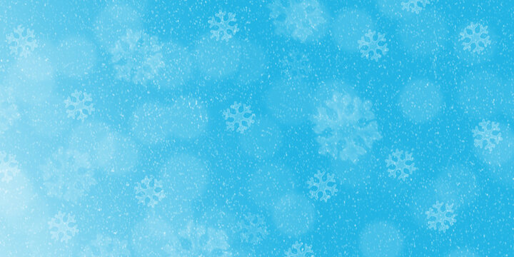 Holiday background for Christmas and New Year design. Falling white snowflakes against a bright cyan blue surface. Winter banner with soft blurred bokeh lights and tiny snow particles