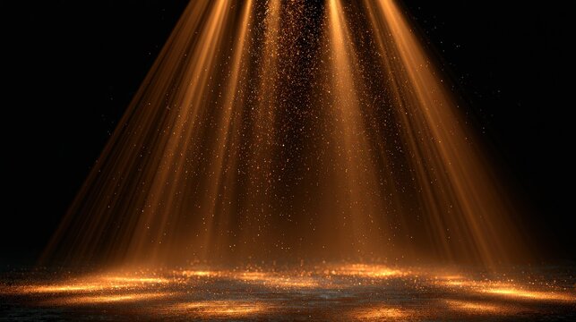 Golden stage lights with sparkles on dark background