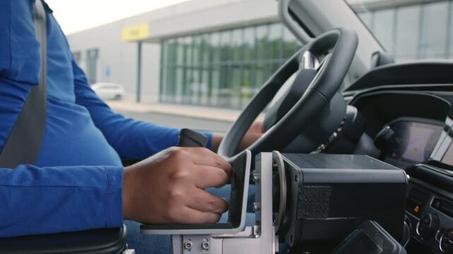 Person with disability using assistive driving technology in an adaptive vehicle to enable mobility and transportation independence