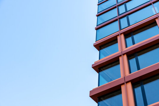 Modern Glass Building Facade Against Blue Sky With Copy Space Urban Architecture Background