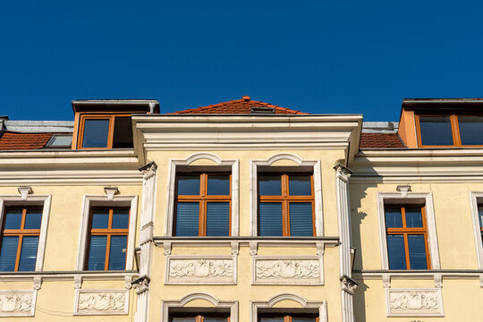 Historic Residential Building Facade With Windows And Blue Sky European Urban Architecture