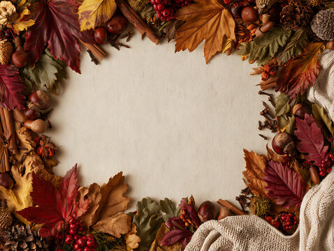 Seasonal decoration with leaves, nuts, and spices displayed on a table in autumn