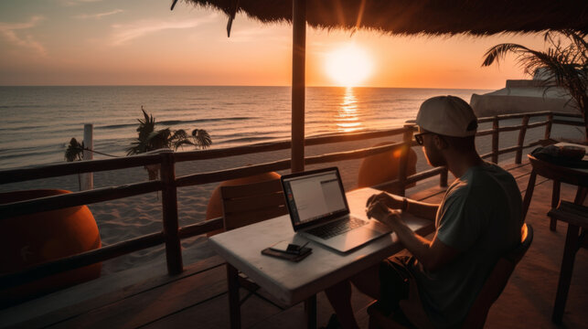 Remote Worker Using Laptop at Beachside Cafe at Sunset