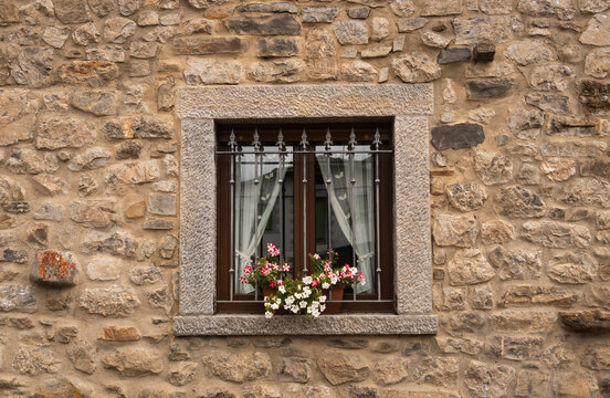abstract detail with window in the old house wall