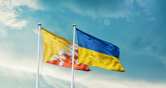 Bhutan and Ukraine friendship flags are waving in the sky. Two country flag for agreement or deal. Bhutan Ukraine national flag for commitment.