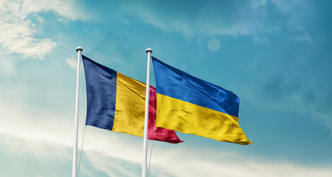 Chad and Ukraine friendship flags are waving in the sky. Two country flag for agreement or deal. Chad Ukraine national flag for commitment.