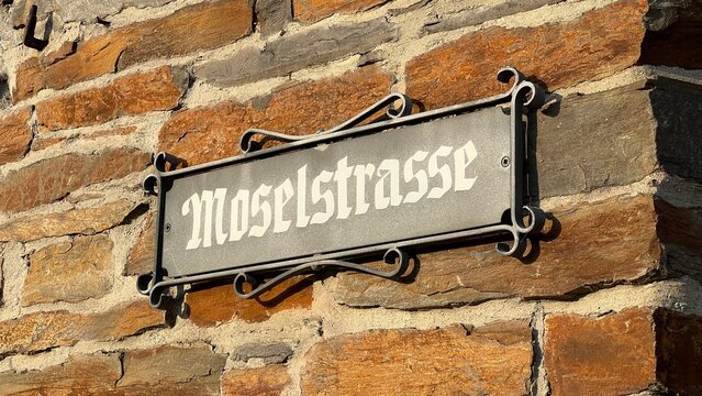 Historic German Street Sign for Moselstrasse on Slate Stone Wall in Alken