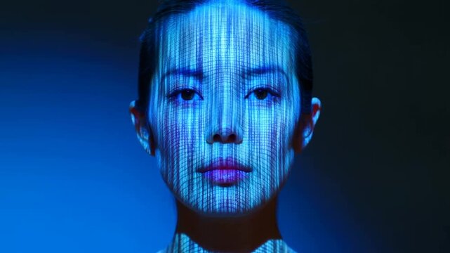 Woman with blue digital code projected on face in dark futuristic setting
