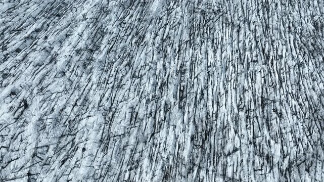 Aerial view of a large glacier surface with countless crevasses in the south of Iceland