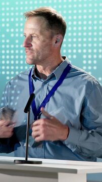 Man, speaker and award on podium at seminar, nomination and thank you speech for recognition. Mature person, talk and pitch at conference with trophy, corporate excellence and outstanding performance