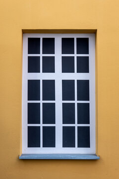 Bricked-Up Window Decorated with a Painted Architectural Illusion