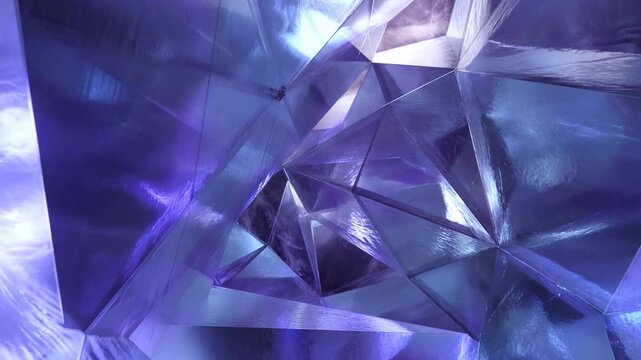 Abstract Blue and Purple Crystal Shapes Forming a Reflective Geometric Background