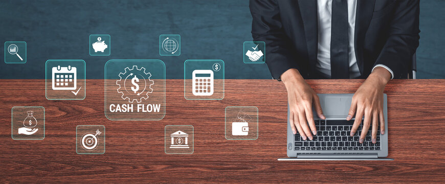 Business Professional Managing Cash Flow with Laptop and Financial Icons on Wooden Desk. Glyphic.