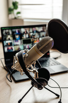 Home studio for podcast recording. Interior with microphone and laptop on table