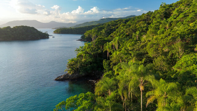 Aerial view of the calm and green lagoon with crystal clear water near the island of Ilha Grande, Brazil