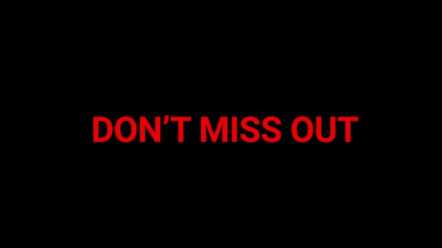 Text sign saying don't miss out appears in bold red letters against a deep black background for promotional marketing campaigns.