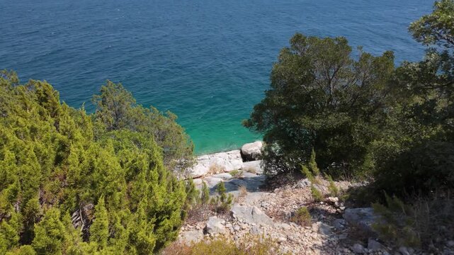Walking on the scenic offroad route of Karaburun peninsula with water sports activities on the distance