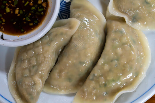 Top Down Flat Lay of Korean Steamed Dumplings Mandu on Ceramic Plate