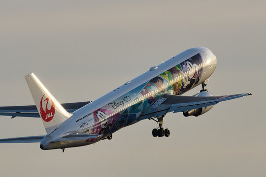 Japan Airlines Boeing 767-300ER (JA615J) passenger plane in Disney100 Dream Express livery taking off from Haneda Airport