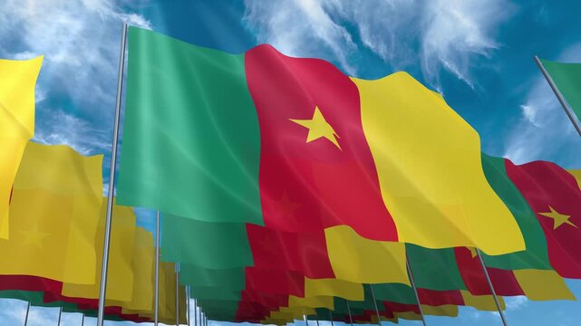 Multiple Cameroon flags seamless looping waving on blue sky