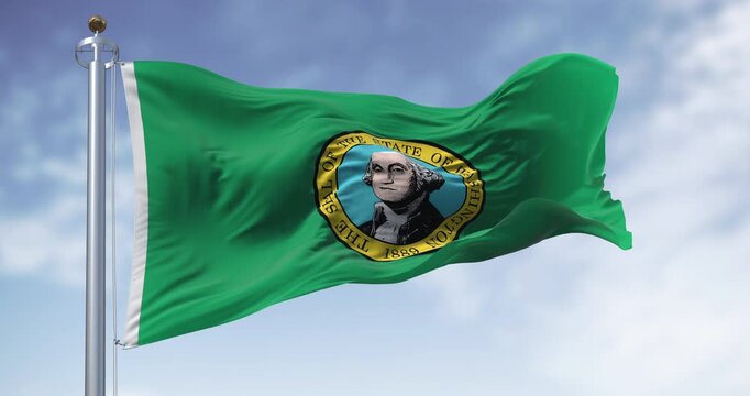 Washington state flag waving on a clear day