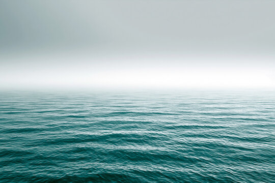 An expansive view of a greenish blue sea with a textured surface of gentle ripples.