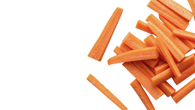 Fresh healthy chopped carrot sticks scattered on clean area isolated on transparent background