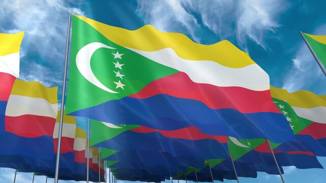 Multiple Comoros flags seamless looping waving on blue sky