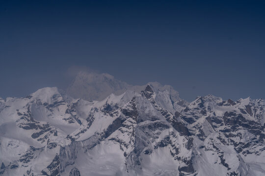 Aerial view of snow-capped peaks in the Himalayas range in Gilgit, Pakistan.