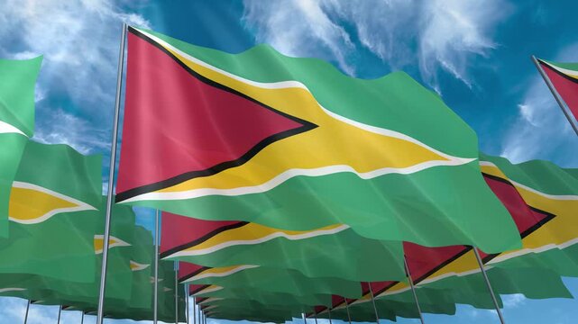 Multiple Guyana flags seamless looping waving on blue sky