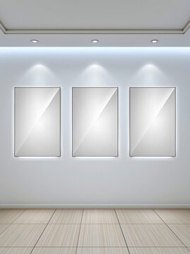 Blank posters in a modern gallery room with three illuminated frames, white walls, and tiled wood floor for branding, signage, or exhibition mockup use.
