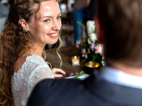 Bride smiling during wedding reception.