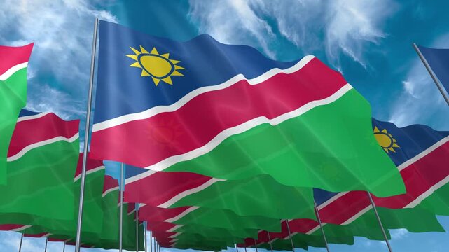 Multiple namibia flags seamless looping waving on blue sky