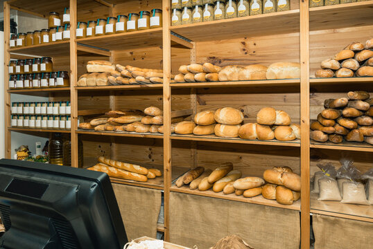 Bakery interior displaying fresh bread loaves and jars