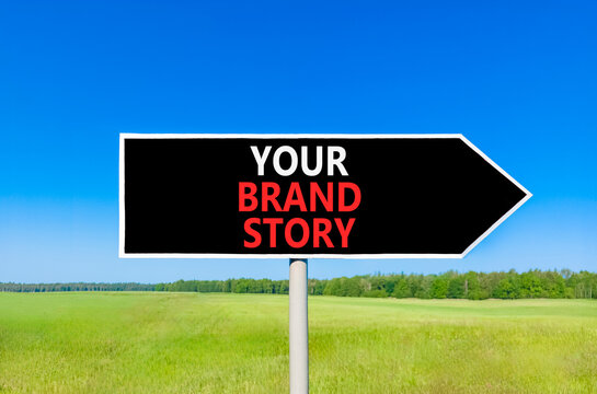 Branding and your brand story symbol. Concept words Your brand story on beautiful black road sign. Beautiful blue sky green grass background. Business branding your brand story concept. Copy space.
