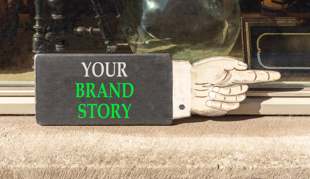 Branding and your brand story symbol. Concept words Your brand story on beautiful black information sign. Beautiful shopfront background. Business branding your brand story concept. Copy space.