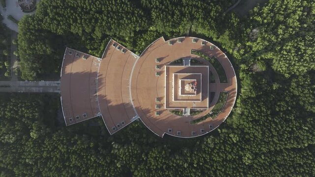Aerial drone view of Mui Ca Mau National Park in Dat Mui, Ca Mau, Vietnam, featuring the national flagpole and coordinate marker surrounded by sunlit mangrove forests.