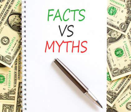 Facts vs versus myths words symbol. Concept words Facts vs Myths on beautiful white note. Beautiful dollar bills background. Business and facts vs versus myths concept. Copy space.