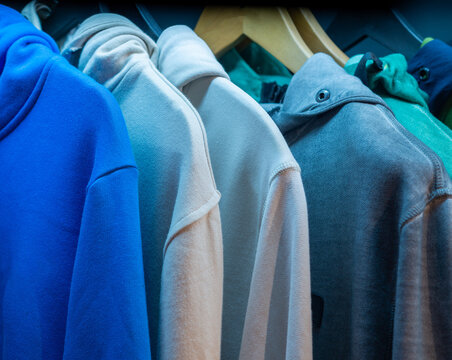 Colorful Hoodies Hanging on Rack